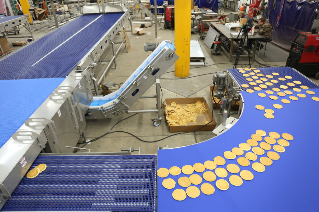 A complete food conveyor system and bakery line for pancakes.